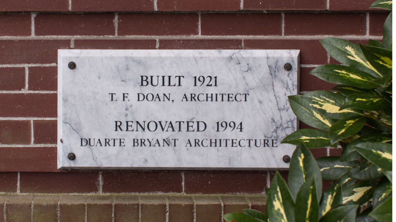 Photo of marble plaque outside of Edens Hall. Text reads "Built 1921 T. F. Doan, architect. Renovated 1994 Duarte Bryant architecture"