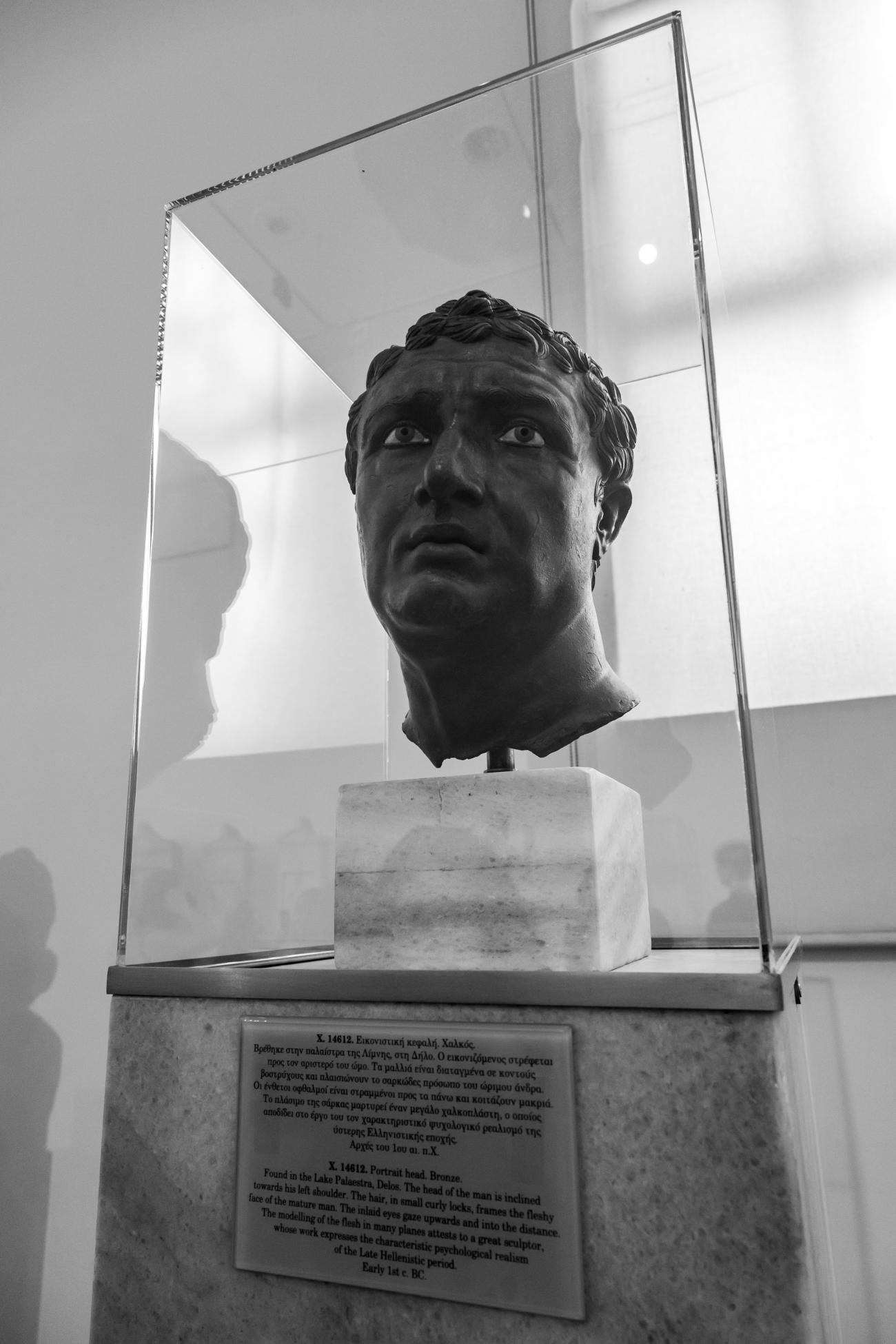 Portrait head made of bronze, found in the Lake Palaestra, Delos, on display at the National Archaeological Museum in Athens