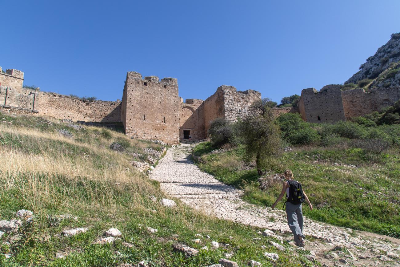 Taylor walking toward Acrocorinth, the fortified acropolis for ancient and medieval Corinth