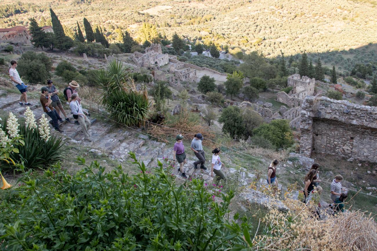 View of students walking through ancient Mystras