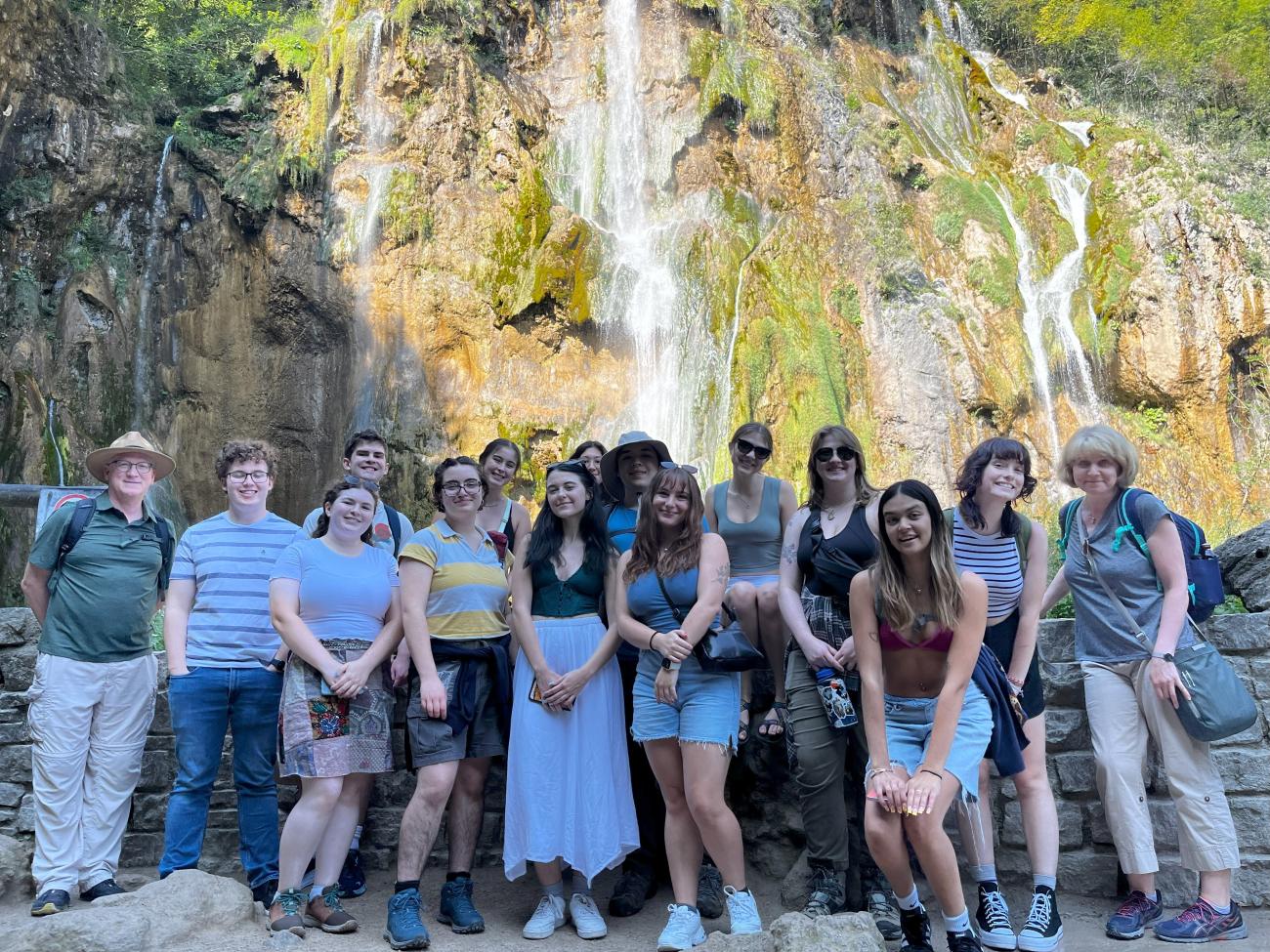 Group photo in front of a waterfall in Plitvice Lakes National Park