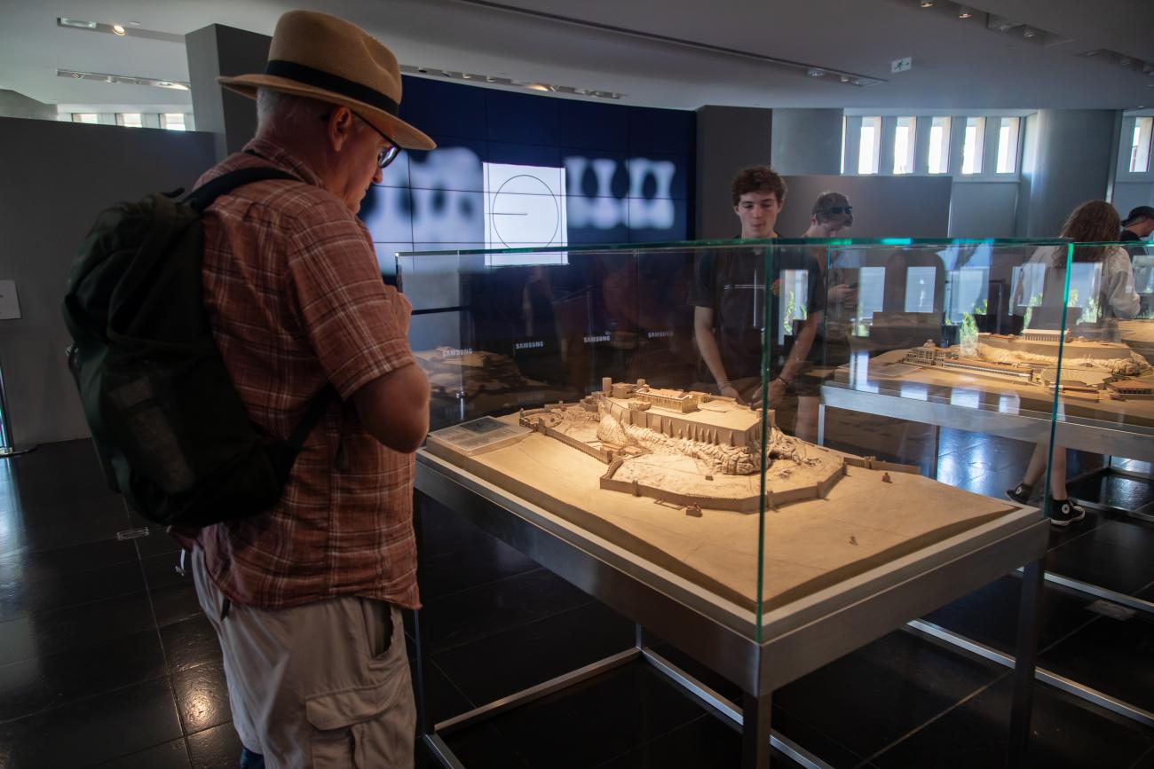 Dr. Linneman and Eliot looking at a model of the Acropolis at the Acropolis Museum